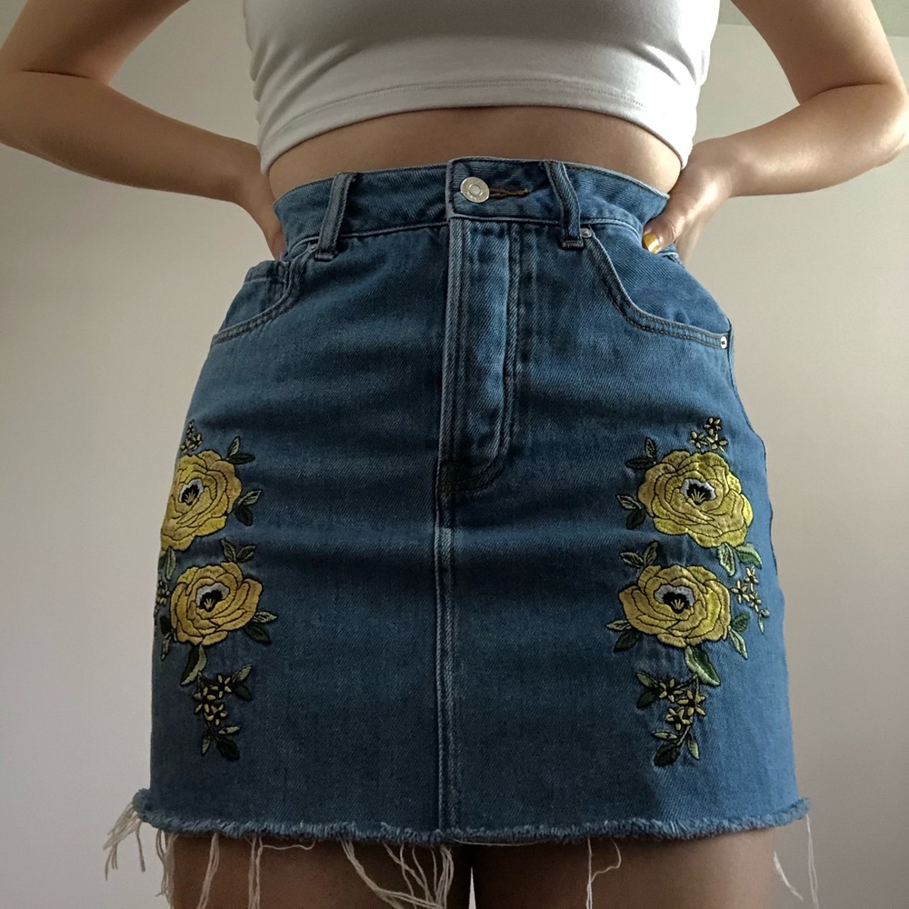 Denim mini skirt with floral appliqués